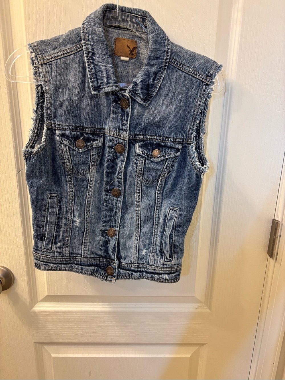 American Eagle Blue denim vest with a distressed look, size S